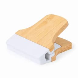 A kitchen scraper with a bamboo handle and a white blade, designed for various cooking tasks. It has a minimalist design.