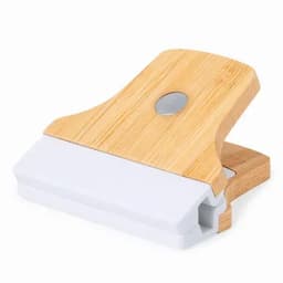 A scraping tool with a bamboo handle and a white plastic blade. It features a simple design and is compact in size.