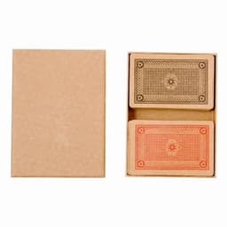 A card deck in a cardboard box featuring two sets of playing cards, one black and one orange. The box is brown.