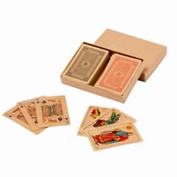 A set of playing cards in a brown box, with two decks and several displayed cards featuring intricate designs.