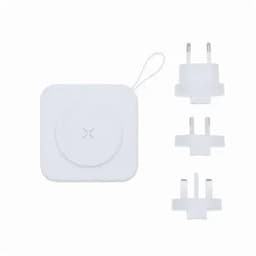 A wireless charger in white, accompanied by three interchangeable plug adapters for different regions.