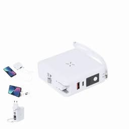 A white portable charger with multiple ports, featuring a handle and connected devices including mobile phones and a power adapter.