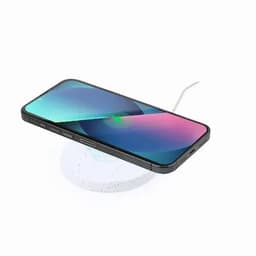A wireless charging pad with a smartphone placed on it, featuring a sleek design and a white colour.