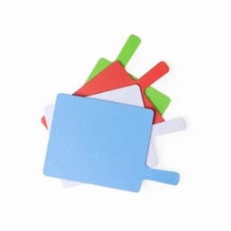 A set of chopping boards in blue, white, red, and green, with handles for easy use. Each board has a speckled finish.