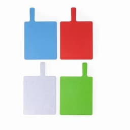 A set of four cutting boards in blue, red, green, and white, featuring a handle for easy use.