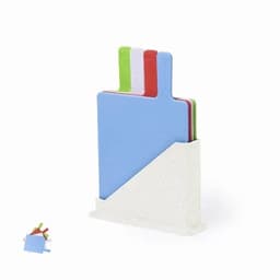 A set of chopping boards in various colours, including blue, green, red, and white, with a white holder.