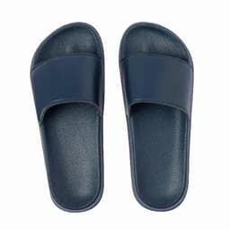 A pair of navy blue slide sandals with a smooth strap and textured sole, featuring a minimalistic design.