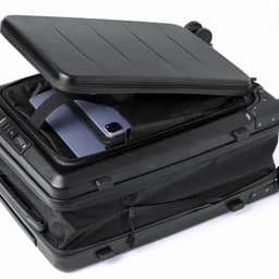 A suitcase with a top panel open, revealing a black interior and a smartphone inside. The suitcase is black with a sleek design.
