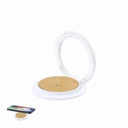 A wireless charging pad with a round bamboo surface and a circular white plastic frame, alongside a smartphone.