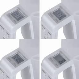 A measuring jug with a digital display, showing measurements for water and milk in various increments. The jug is white.