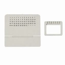 A desk calendar in a light grey colour with a stand, featuring numbers for the days of the month.