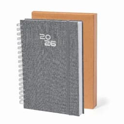 A grey spiral-bound notebook with the year '2026' prominently displayed, alongside a brown hardcover notebook.