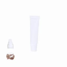 A white cosmetic tube alongside a small pump bottle and a hand applying the product.
