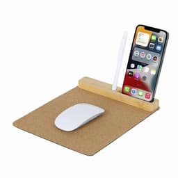 A mouse pad with a cork surface, featuring a wooden stand for a phone and a space for a pen, with a white mouse.