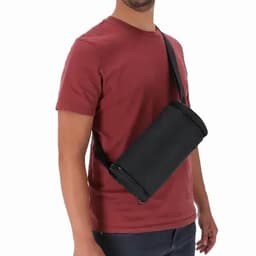 A drink bottle carrier in black, worn on a person’s shoulder with an adjustable strap.