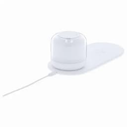 A white diffuser with a translucent lid, resting on a light base, connected by a power cable.