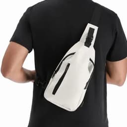 A sling bag in white with black accents, worn over the shoulder, featuring multiple zippered pockets.