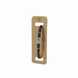 A bracelet featuring a central metal charm with detailing, set on a brown cord, displayed on a cardboard backing.