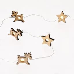 A string of decorative fairy lights featuring wooden reindeer and star shapes connected by a thin wire.