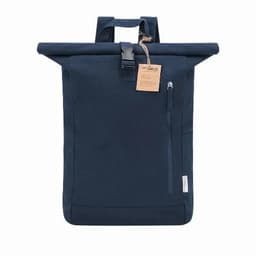 A roll-top backpack in navy blue with a front zipper pocket and a tag, featuring adjustable straps.