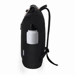 A drink bottle in a side pocket of a black backpack, featuring a sleek design and a logo on the front.
