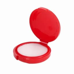 A compact powder case in bright red, featuring a hinged lid and a white powder compartment.