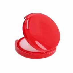 A bright red compact with a mirrored lid, featuring a smooth interior surface.