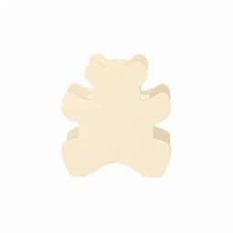 A cream-coloured bear-shaped cookie cutter, featuring a rounded design with cut-out details.