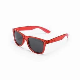 A pair of red sunglasses with dark lenses and a transparent frame. The sunglasses have a logo on the side.