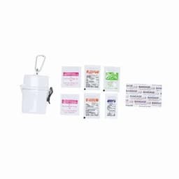A white container with a clip holds various first aid supplies, including packets and adhesive bandages.