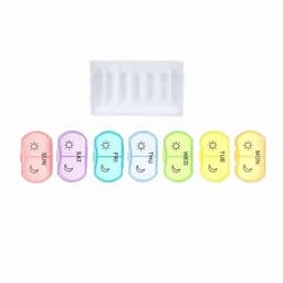 A weekly pill organiser with seven coloured compartments, labelled for each day of the week. Each compartment has a sun and moon symbol.