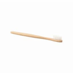 A bamboo toothbrush with a natural wooden handle and white bristles, featuring a simple, eco-friendly design.