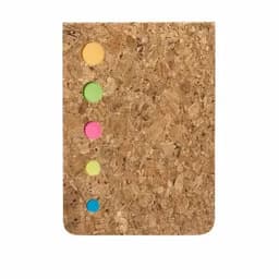 A cork notebook with four colourful sticky tabs in pink, green, blue, and yellow on the side.