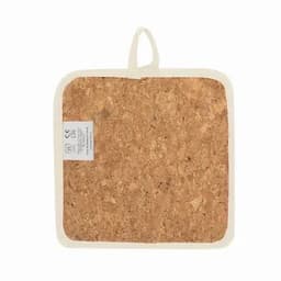 A square cork pot holder with a hanging loop and a fabric border, featuring a label on the bottom corner.