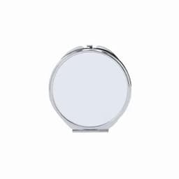 A compact mirror with a round silver case and a polished mirror surface.