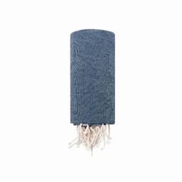 A blue woven towel with fringed edges, neatly rolled up. It features a textured pattern throughout.