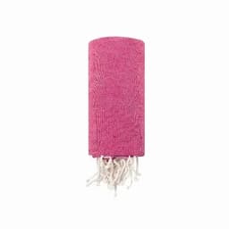 A pink towel with white tassels, neatly rolled up and featuring a textured fabric design.
