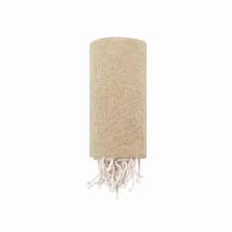 A beige throw blanket with fringed edges, neatly rolled up. The material appears soft and textured.