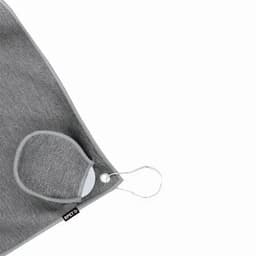 A grey face mask with a loop for attachment, displayed against a light background. It features a small logo tag.