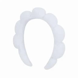 A white headband featuring a scalloped design, made from soft material. It has a simple, elegant look.