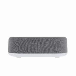 A speaker in a modern design features a grey fabric texture and a white base, with a logo on the front.