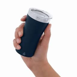 A drink bottle in a hand, featuring a sleek black body and a silver lid. It has a logo on the surface.