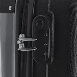 A close-up of a black suitcase zipper lock, featuring a silver metal latch and a combination dial. The zipper is partially open.