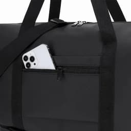 A black duffle bag featuring a front zip pocket with a smartphone partially visible inside.