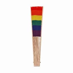 A rainbow-coloured fan with vertical stripes of red, orange, yellow, green, blue, and purple, mounted on a wooden base.