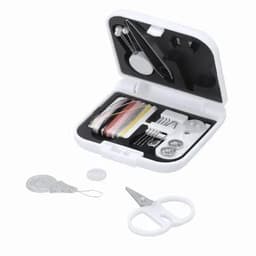 A sewing kit with white case, containing threads, needles, buttons, scissors, and a measuring tape. 