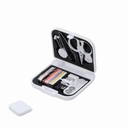 A compact sewing kit featuring various tools, threads, and buttons, housed in a white case.