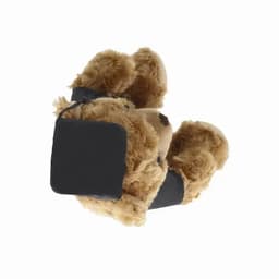 A plush teddy bear with brown fur wearing a black headband and wrist bands, featuring a small tag.