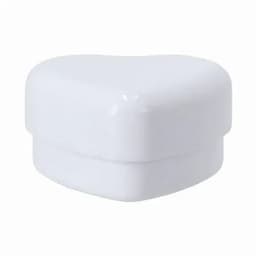 A heart-shaped white container with a smooth finish, featuring a lid and a simple design.