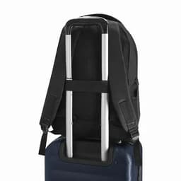 A black backpack with adjustable straps resting on a blue suitcase handle, featuring a sleek design.